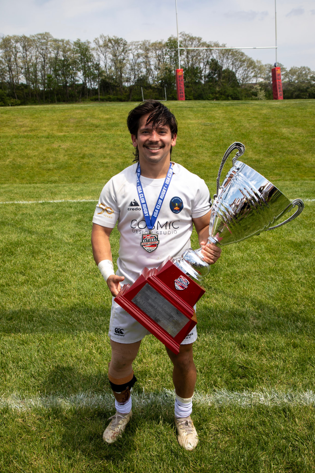 Adrian holding the USA Club Rugby national championship trophy